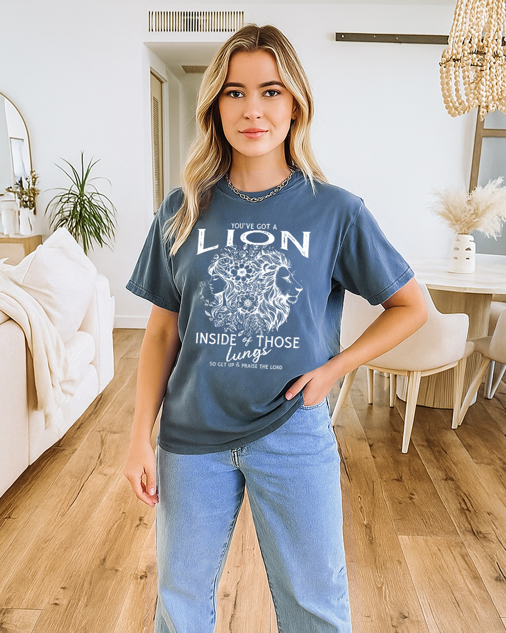 Blue Jean Comfort Colors shirt with praise-themed lion artwork. Styled with jeans and peaceful expression.