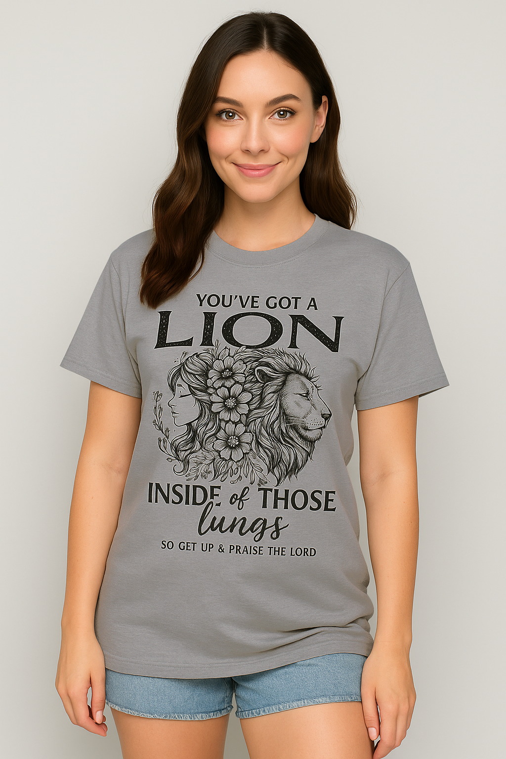 Grey Comfort Colors t-shirt with bold “Lion Inside of Those Lungs” Christian quote. Simple and grounded design for worship wear.