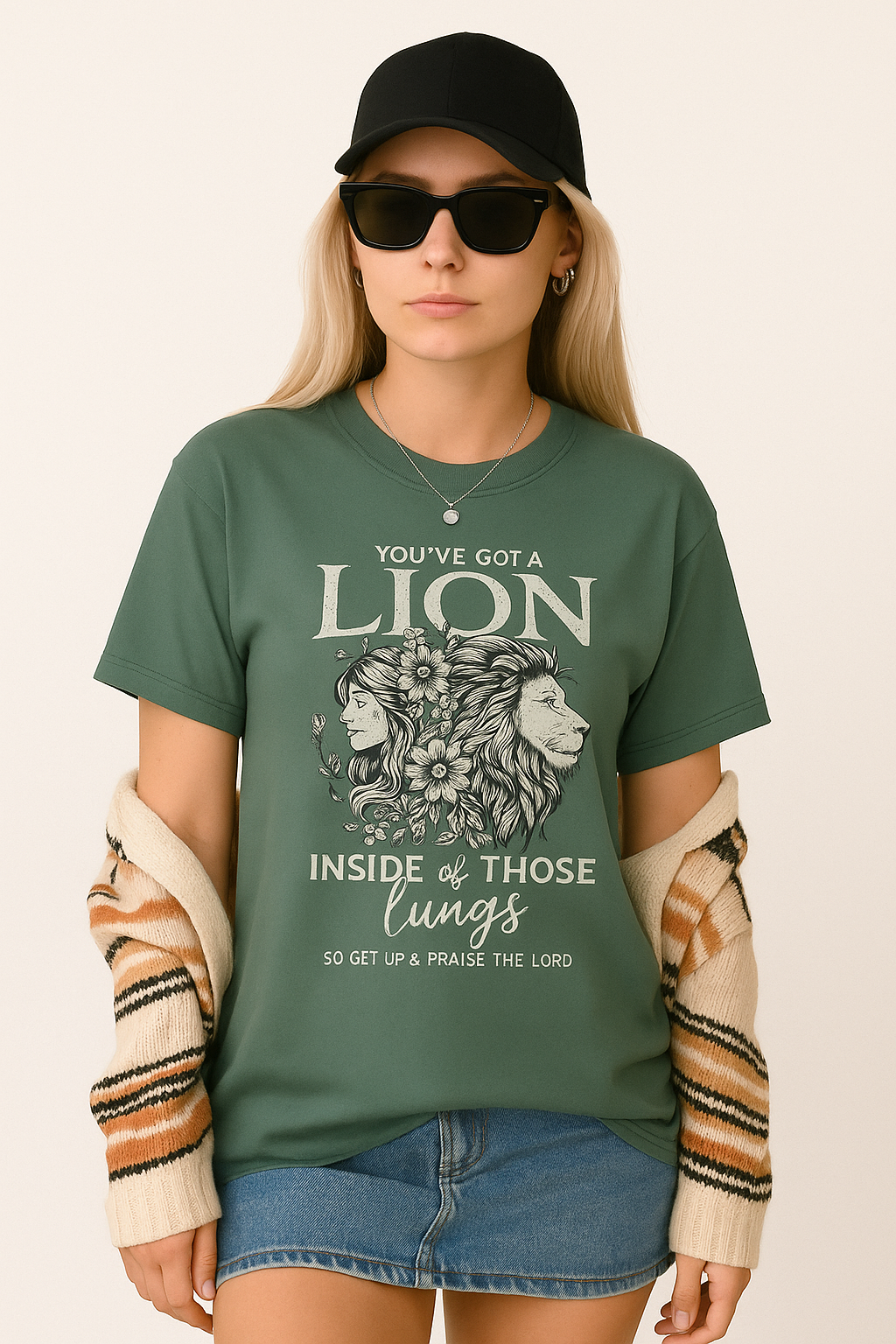 Moss green Comfort Colors tee with worship quote and lion illustration. Bold Christian shirt styled with casual energy.