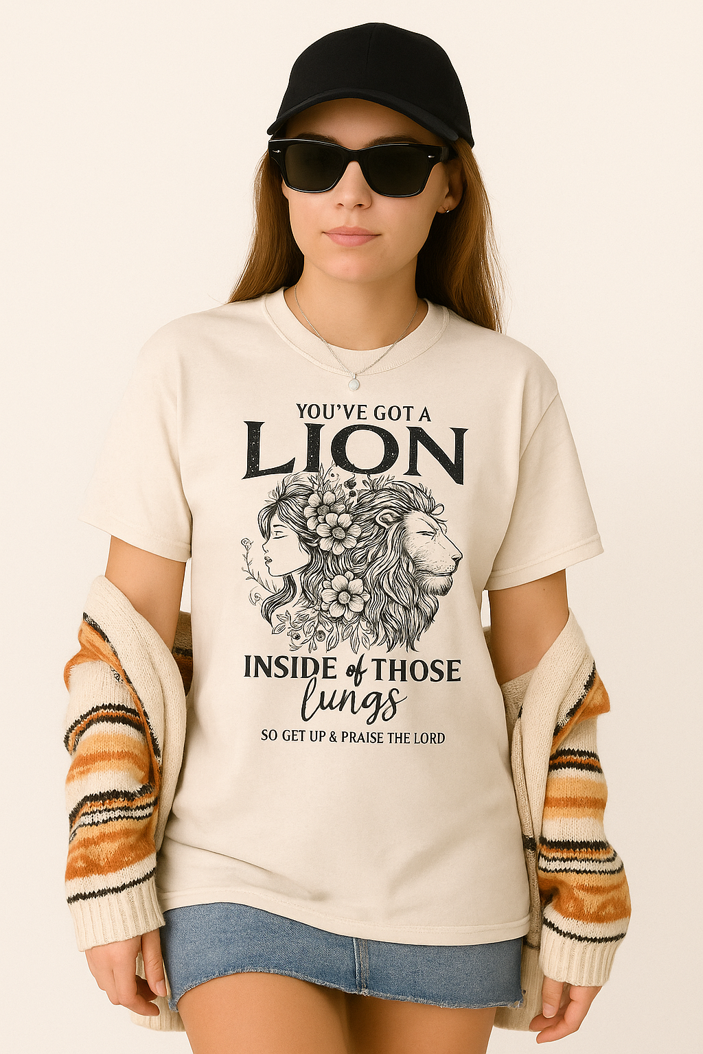 Ivory Comfort Colors shirt featuring lion and praise quote “So Get Up & Praise the Lord.” Modeled with black sunglasses and relaxed fit.