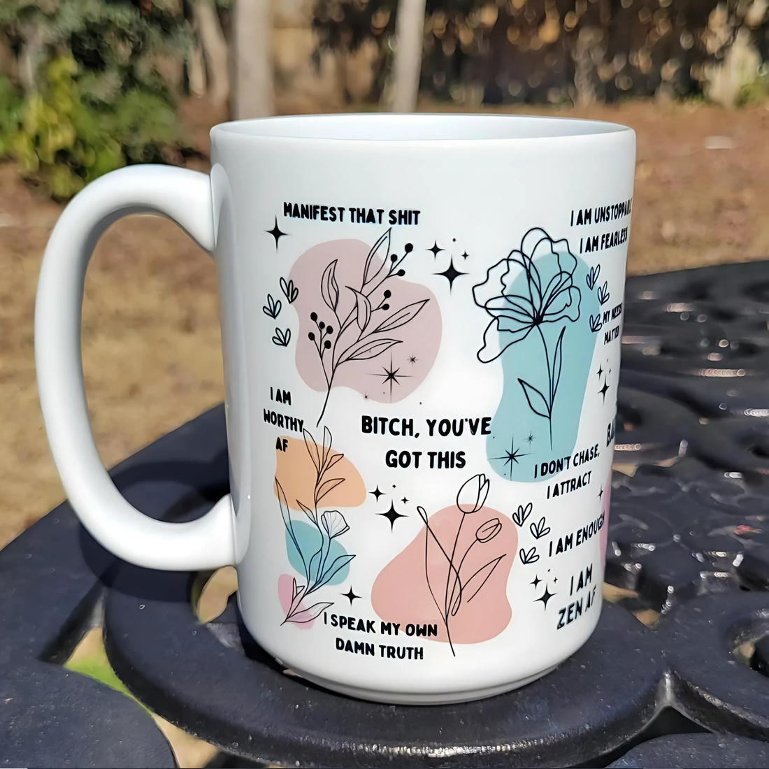 Woman holding a motivational coffee mug with colorful daily affirmations, cozy sweater aesthetic, empowering mental health vibe.

