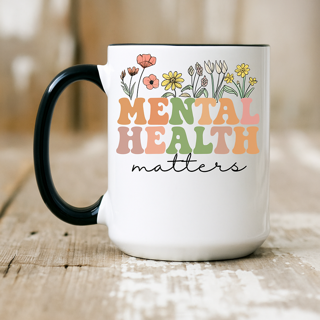 Person holding Mental Health Matters mug with black interior, wearing a warm knit sweater. Mental health gift scene.