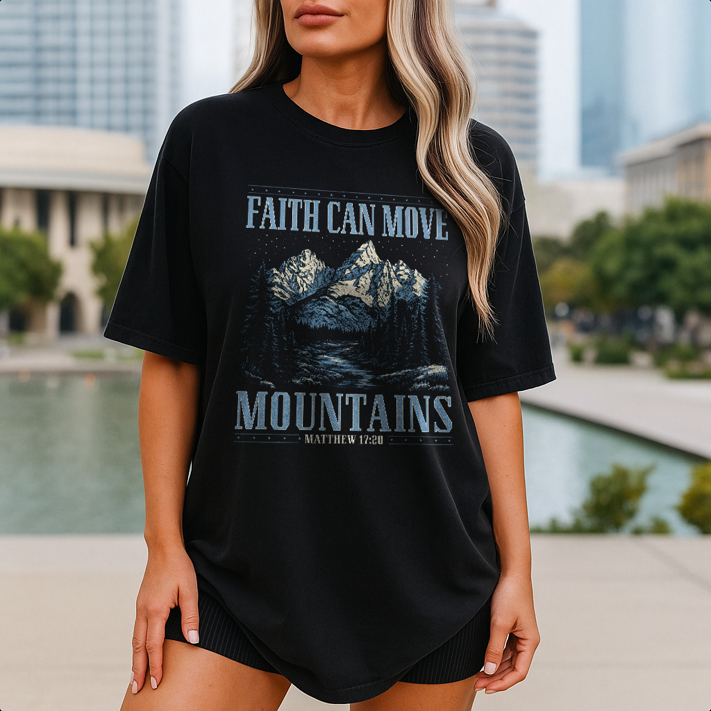 Man in black Matthew 17:20 tee with mountain graphic, faith-based Christian design