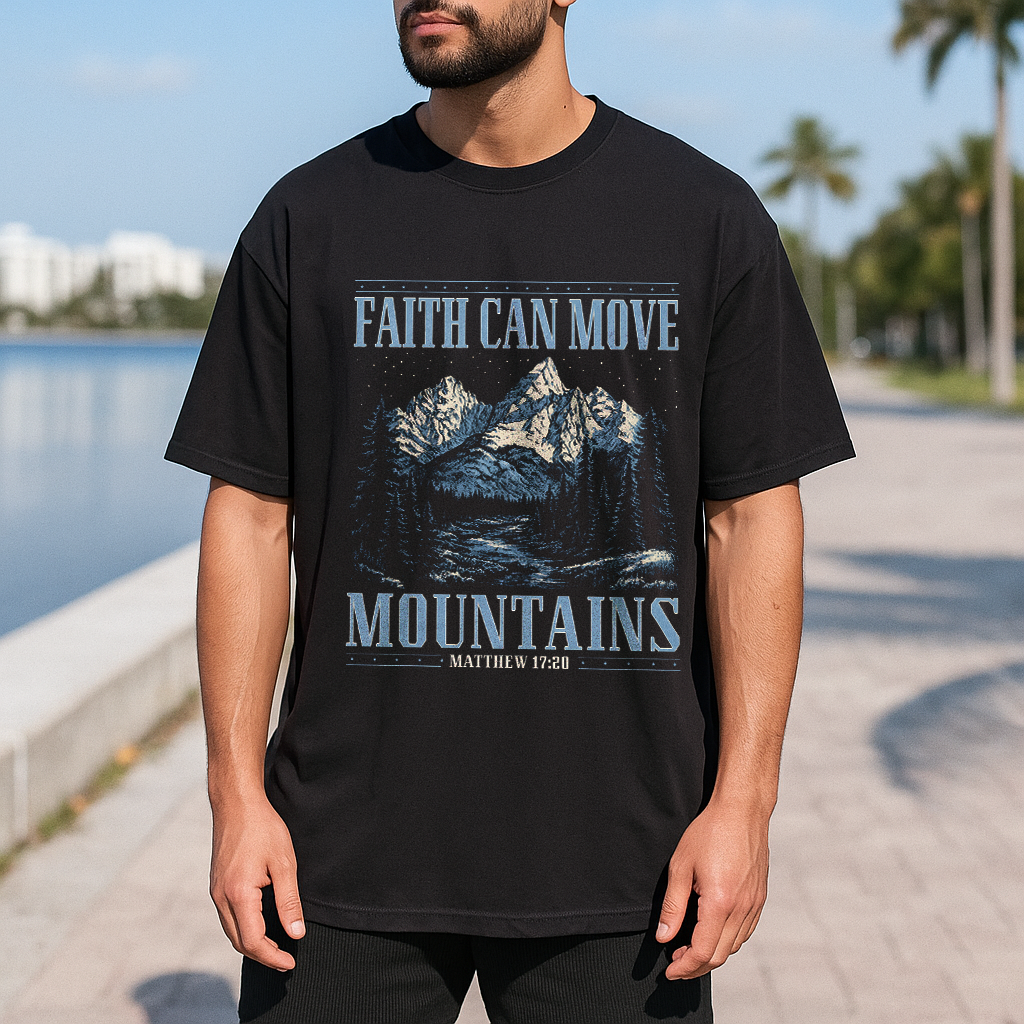 Man in black Matthew 17:20 tee with mountain graphic, faith-based Christian design