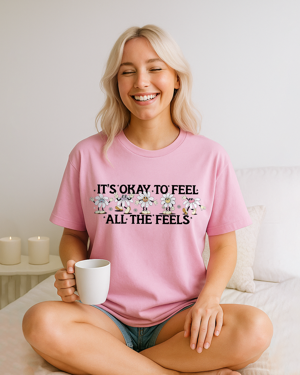 Blossom pink Comfort Colors shirt with playful daisy character design and “It’s Okay To Feel All The Feels” quote
