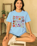 Woman in light blue Comfort Colors 1717 tee sitting casually; floral mental health shirt for self-love and calm days.