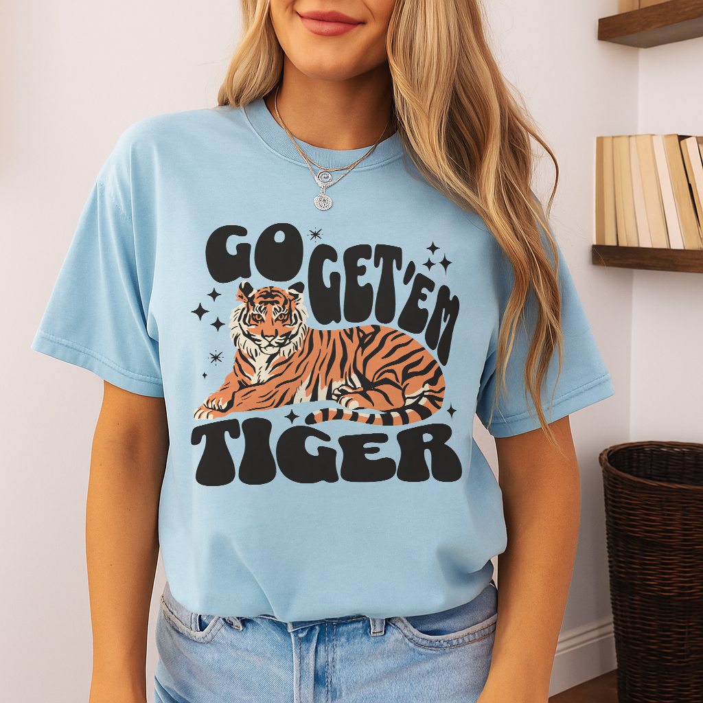 Go Get 'Em Tiger t-shirt in Chambray – light sky blue tone, unisex retro design with groovy 70s typography and motivational tiger illustration, perfect for casual wear.