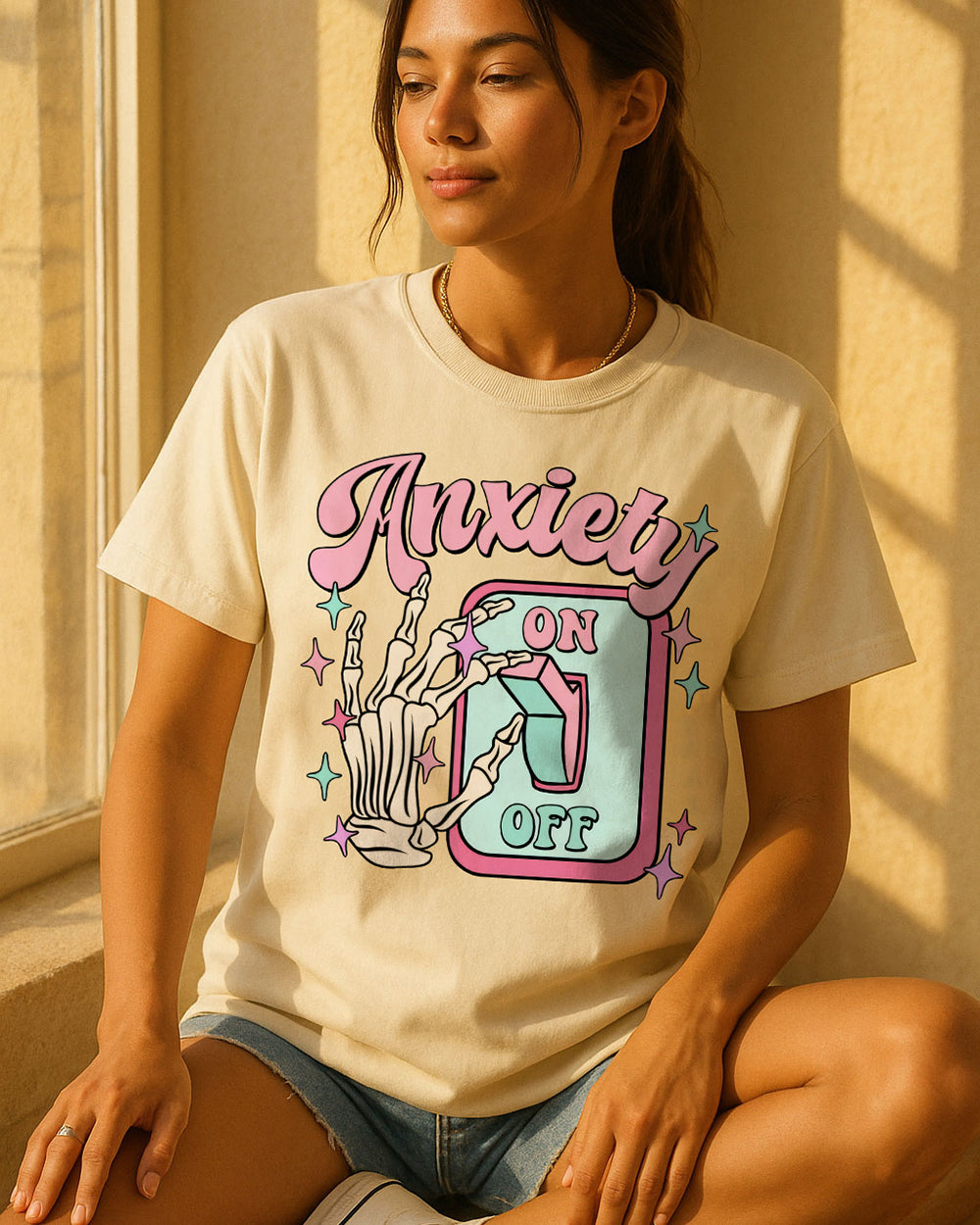 Ivory Comfort Colors 1717 shirt with dark humor “Anxiety On/Off” design and skeleton artwork