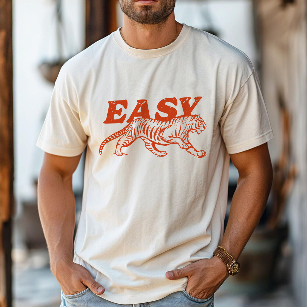 Man in ivory tiger graphic tee with “EASY” text, retro bold print