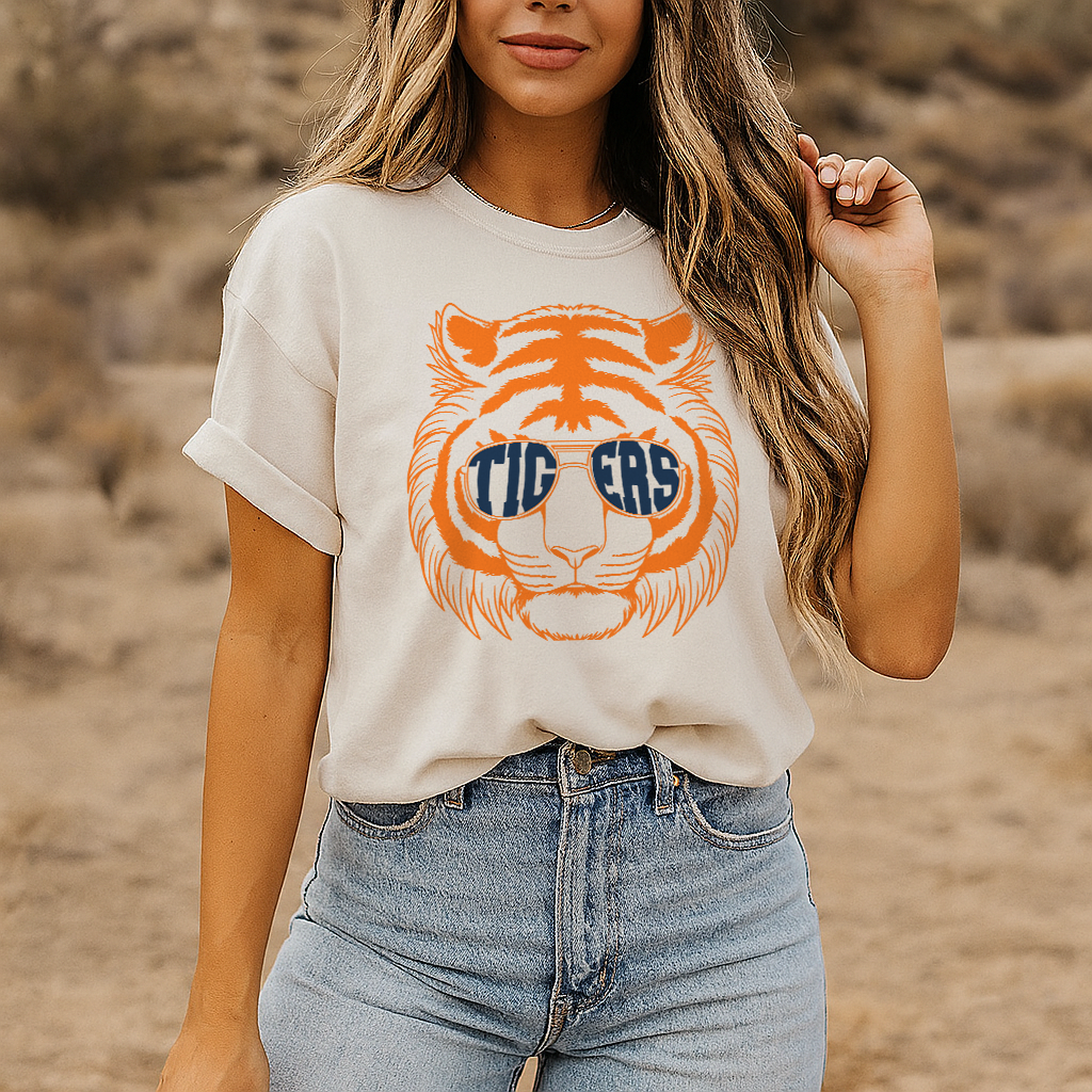 Ivory Comfort Colors tee with retro orange tiger and bold blue "TIGERS" sunglasses print.