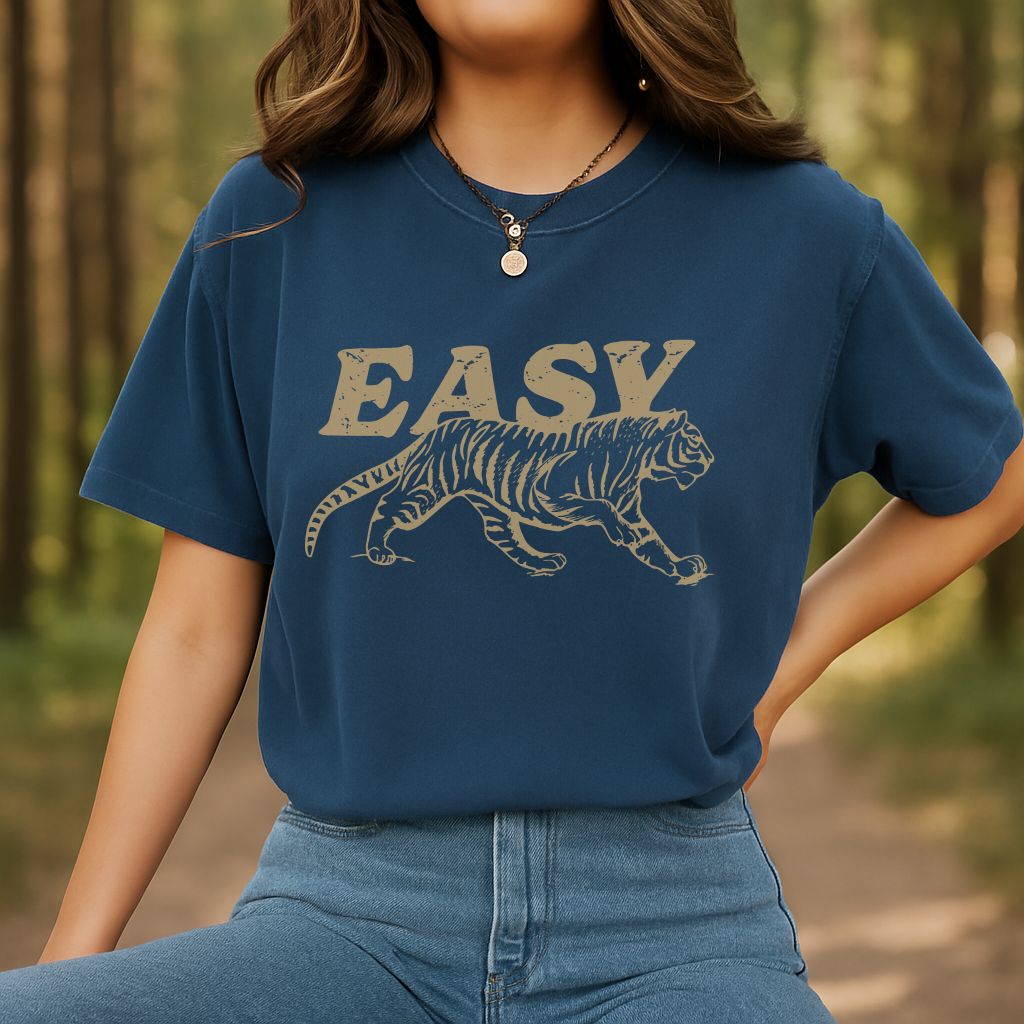 Woman outdoors in navy Comfort Colors t-shirt with tiger and EASY graphic