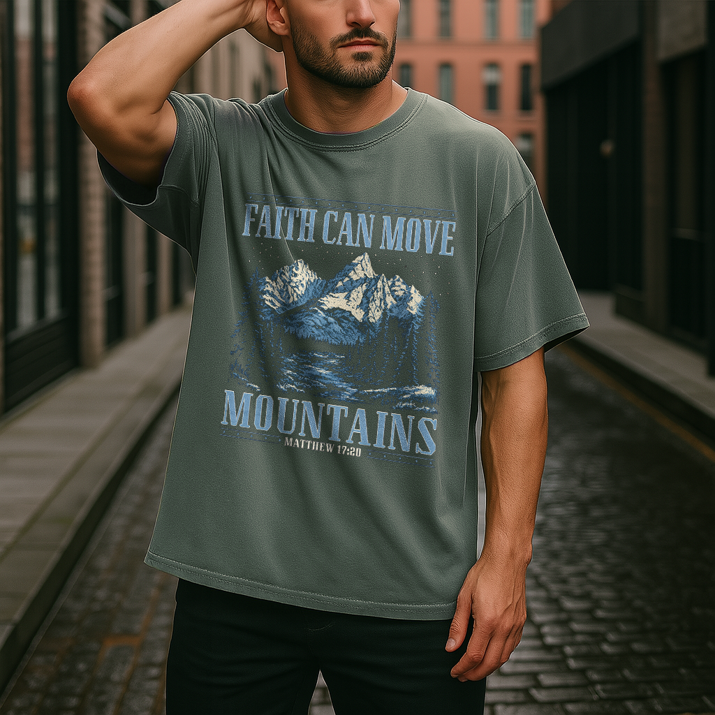 Man in moss green Christian shirt with mountain and Bible verse Matthew 17:20