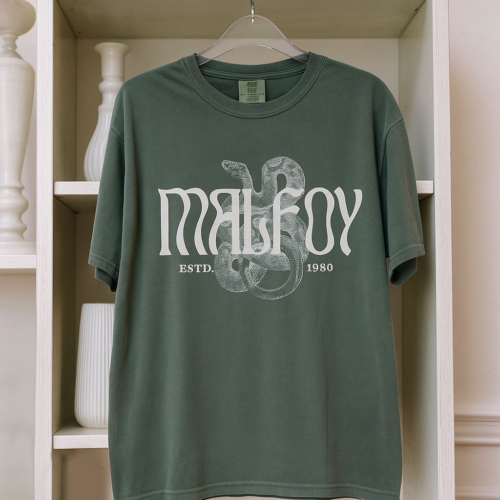 Flatlay of Malfoy T-shirt in Moss green on white shelf