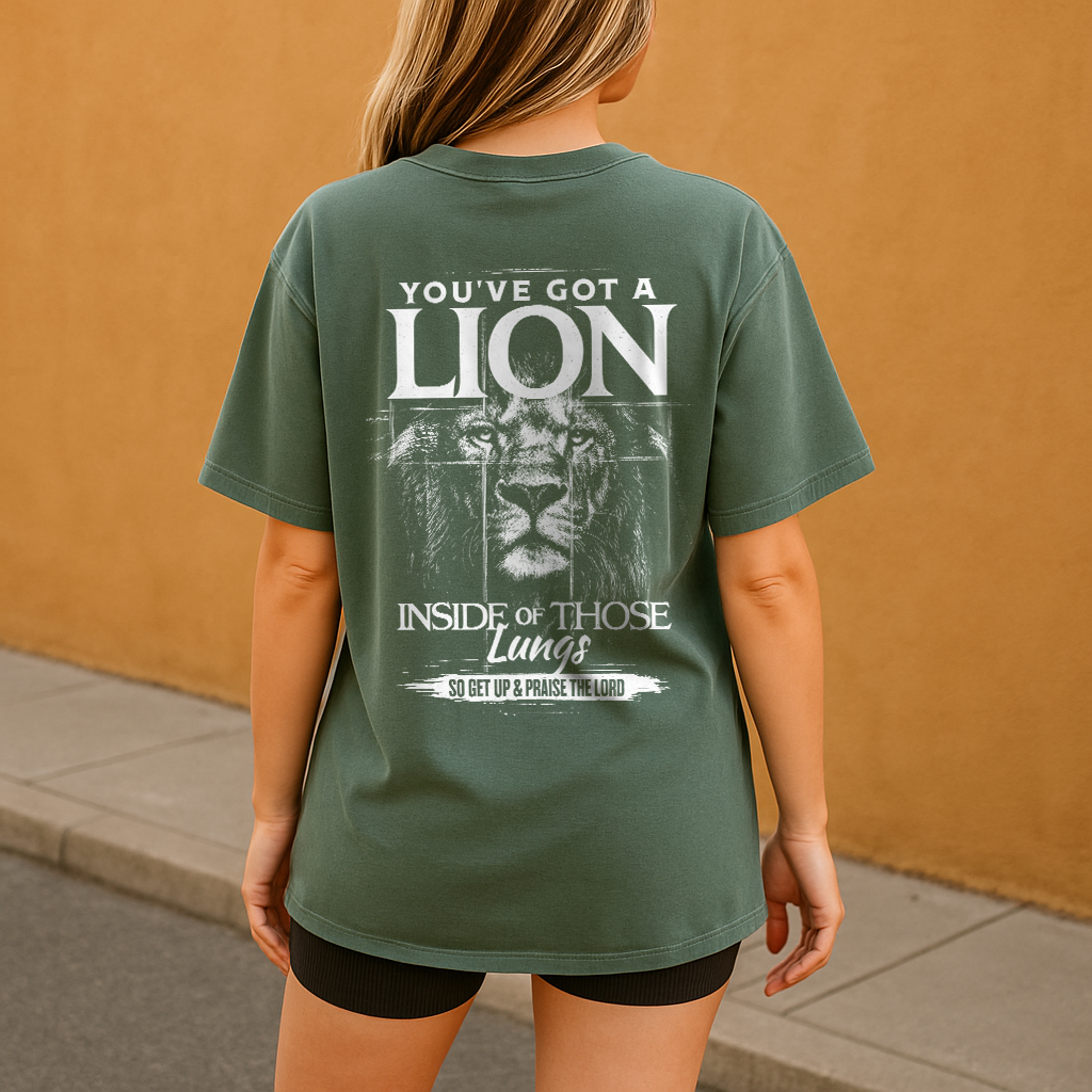 Woman in moss green oversized Christian t-shirt with faith quote on back