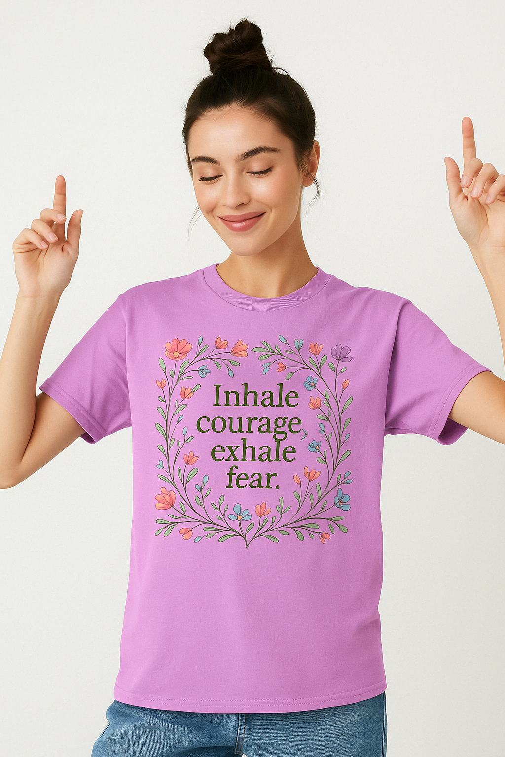 Orchid lavender Comfort Colors tee featuring “Inhale courage, exhale fear” quote in floral design, modeled by woman with bun hairstyle.