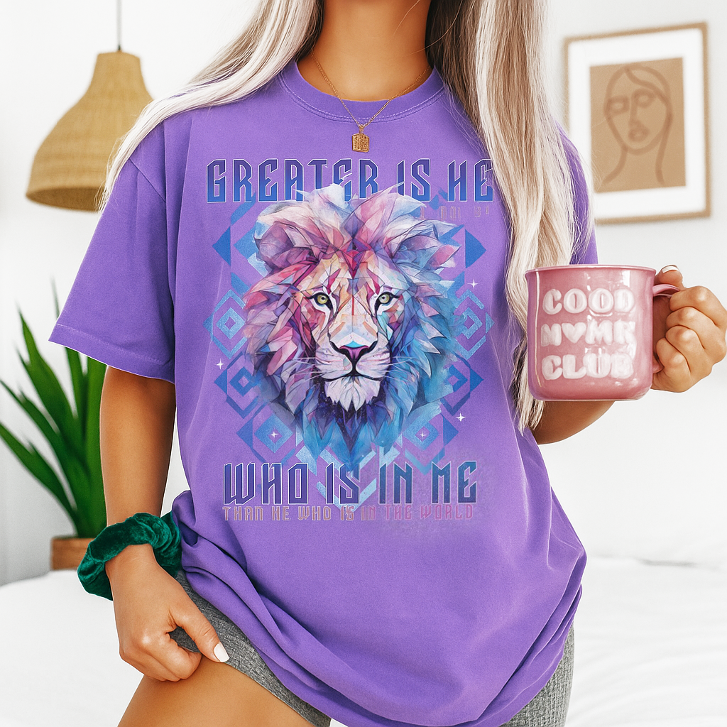 Woman holding a mug and wearing violet Lion of Judah shirt with colorful mane and Bible verse – spiritual and bold Christian tee.