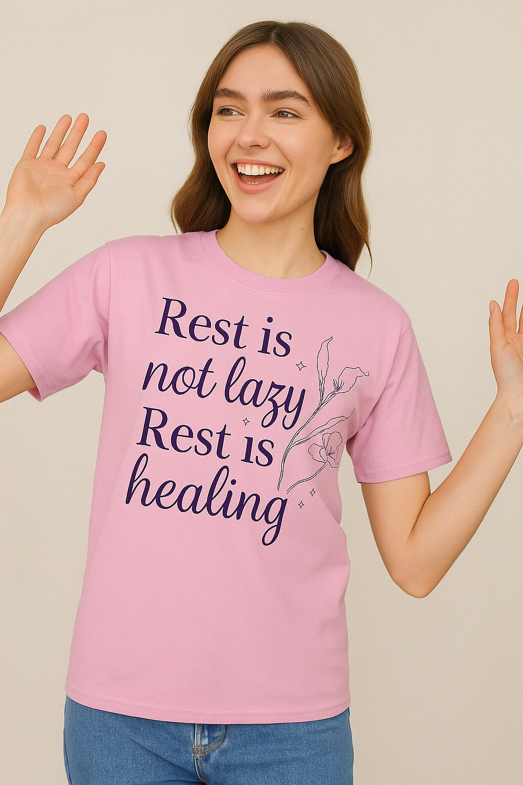 Blossom pink Comfort Colors tee with “Rest is not lazy. Rest is healing” quote, worn by smiling woman in casual jeans.