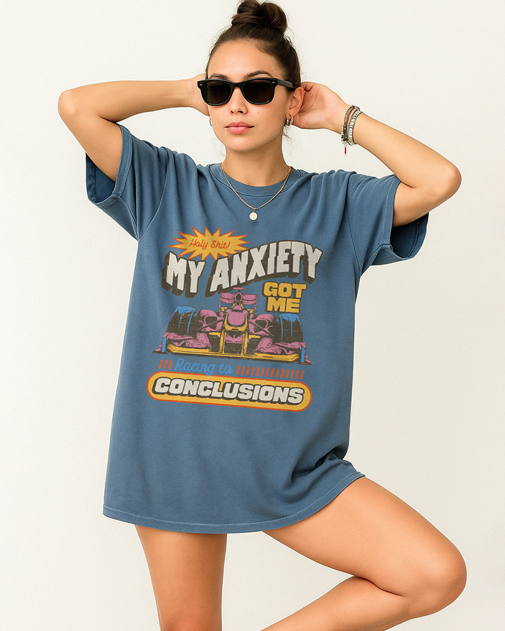 Black Comfort Colors shirt with a bold "My Anxiety Got Me Racing to Conclusions" design and colorful retro race car print
